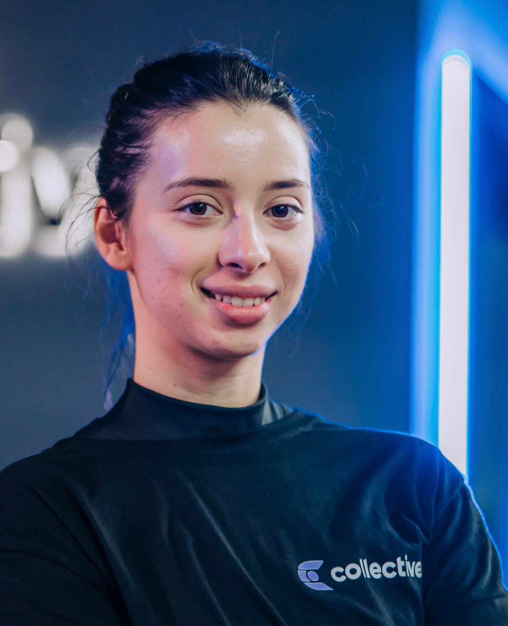 Athletic female trainer using a cardio machine in a gym